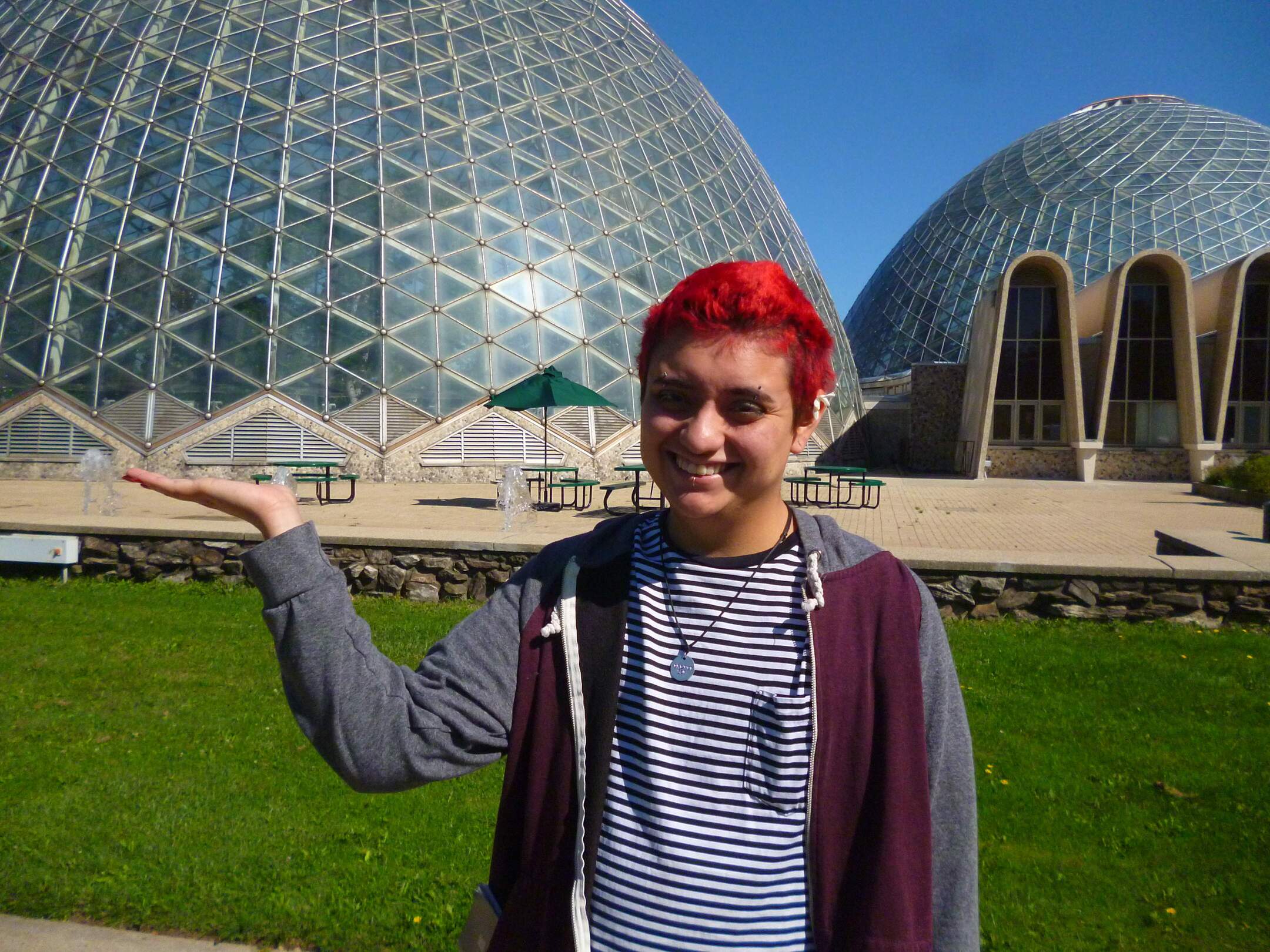 David standing in front of the horticulture domes in Miluwaukee pretending to hold one up like people do with the pyramids. He is far too close for it to be convincing.